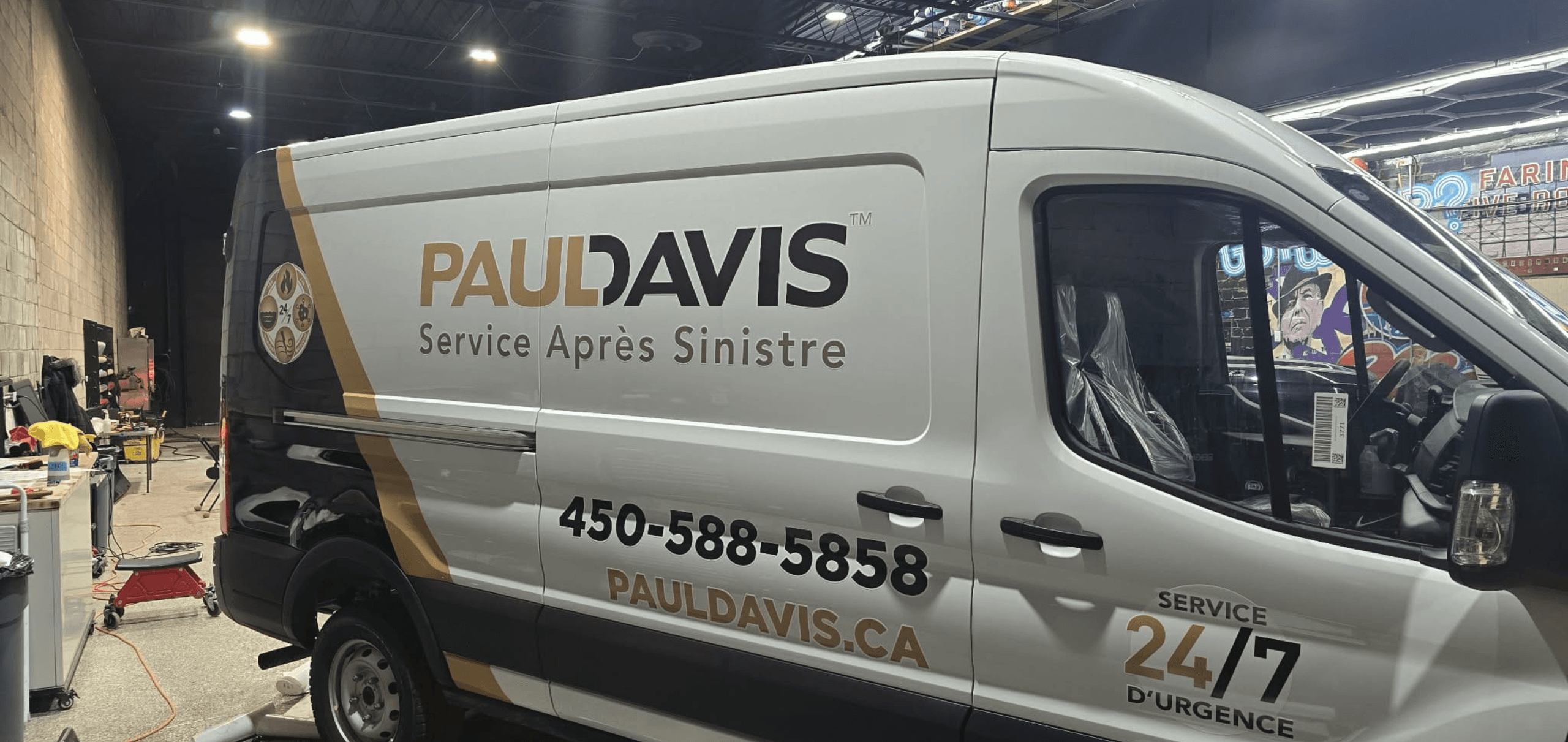 Paul Davis service van with gold and black lettering